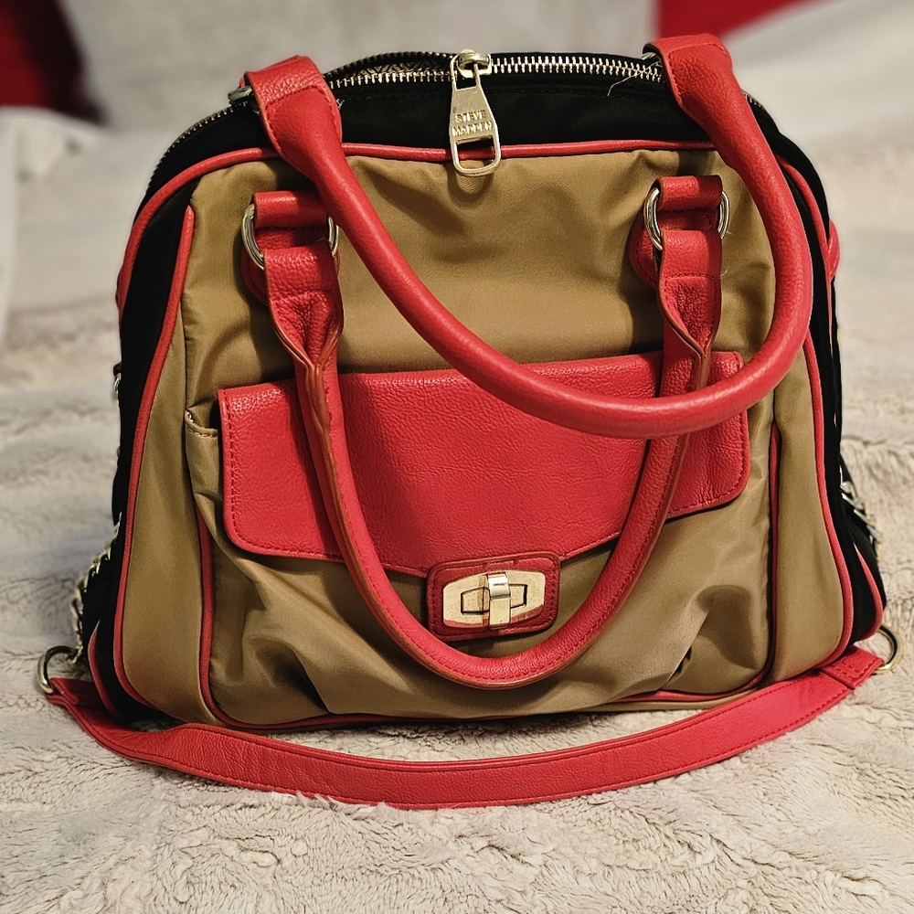 Orange, blue,and tan Steve Madden purse with orange handles and removable strap